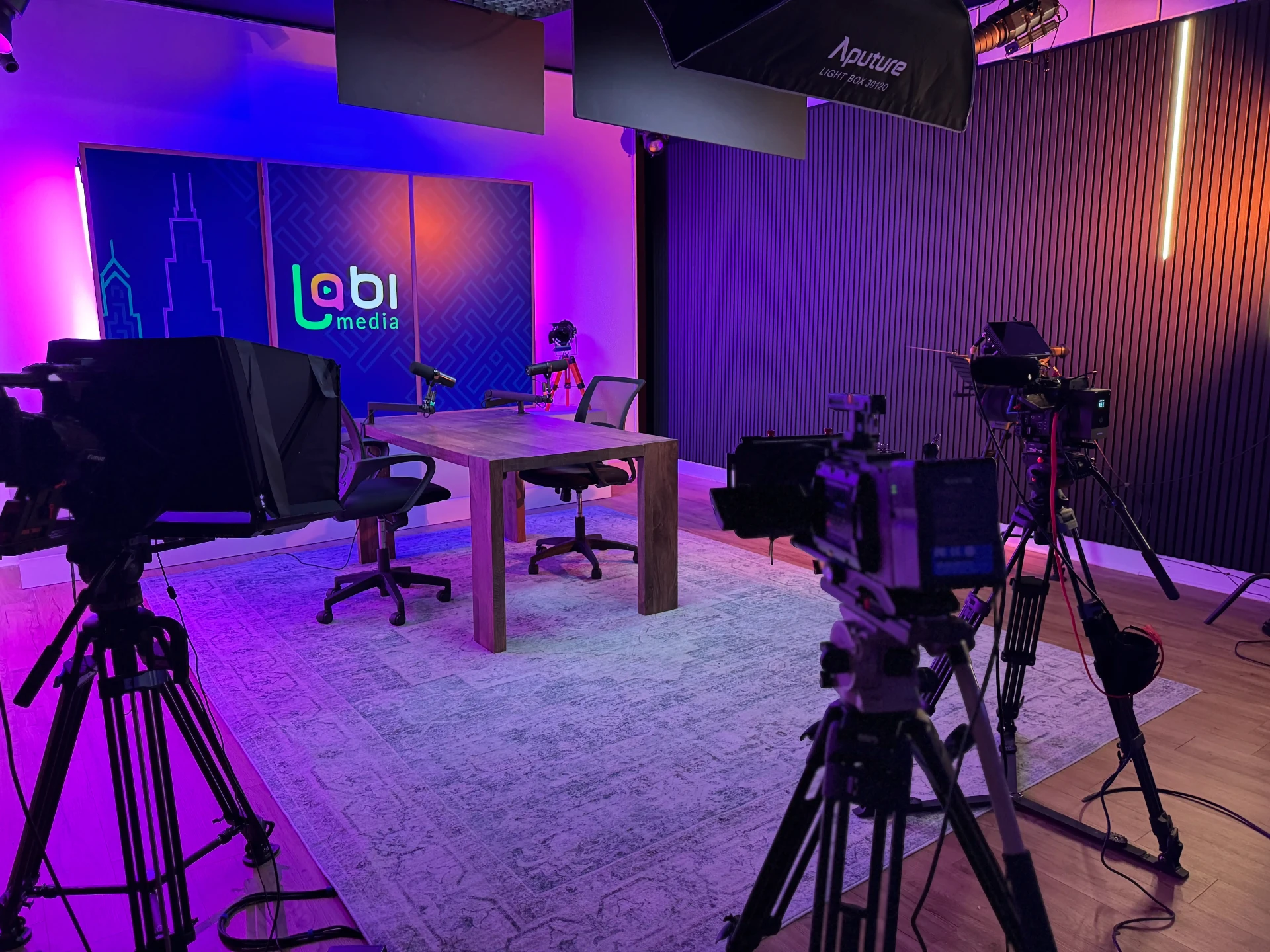 Lobi Media studio with broadcast cameras, teleprompter and lit backdrop in Chicago