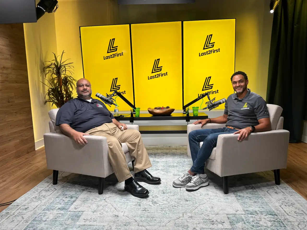 Two guests recording an interview in the Lobi Space podcast room in Chicago