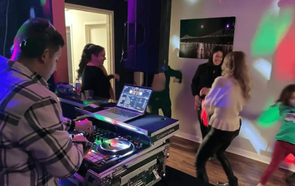 DJ and members at an evening community event at Lobi Space in Chicago