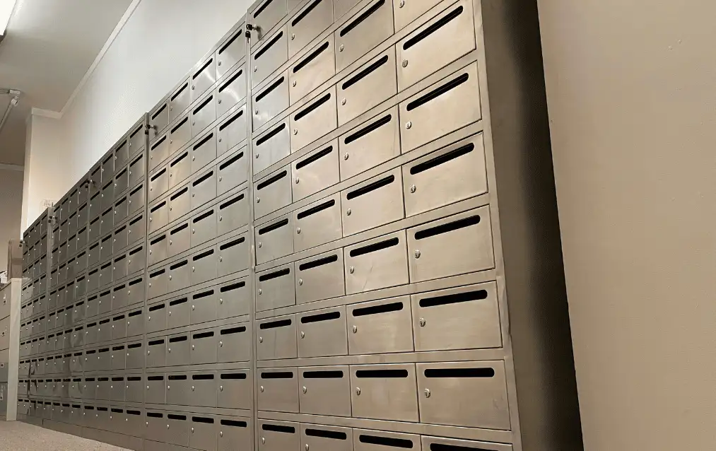 Wall of stainless steel business mailboxes at Lobi Space in Chicago