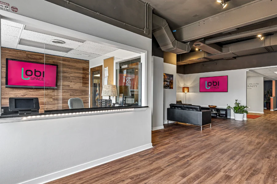 The staffed front desk and lobby inside Lobi Space at 1655 S Blue Island Ave in Pilsen, Chicago
